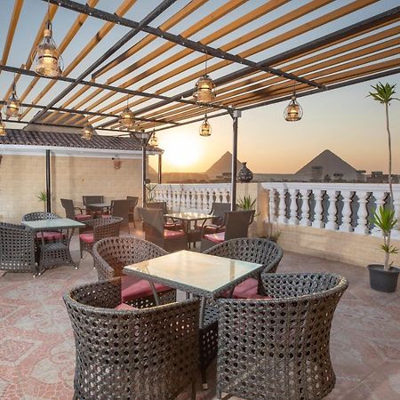 Pyramids Inn Hotel Kafrat al Jabal Bagian luar foto