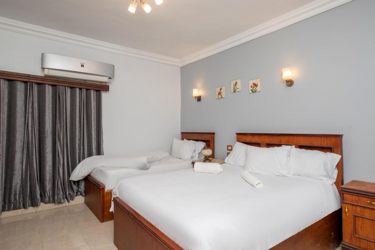 Pyramids Inn Hotel Kafrat al Jabal Bagian luar foto